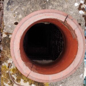 view looking down into a clay chimney flue