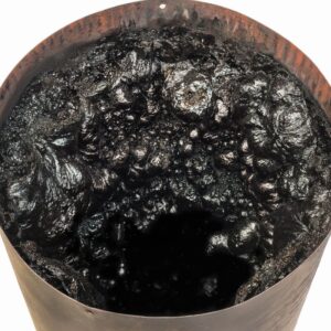 tar-like creosote inside a chimney flue pipe